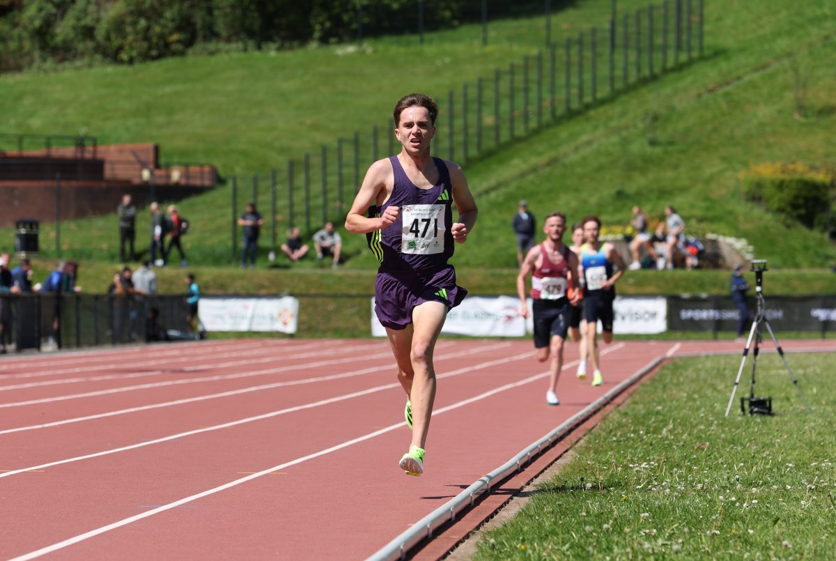 Young male runner Henry McLuckie celebrating after breaking long-standing stadium record on Belfast track