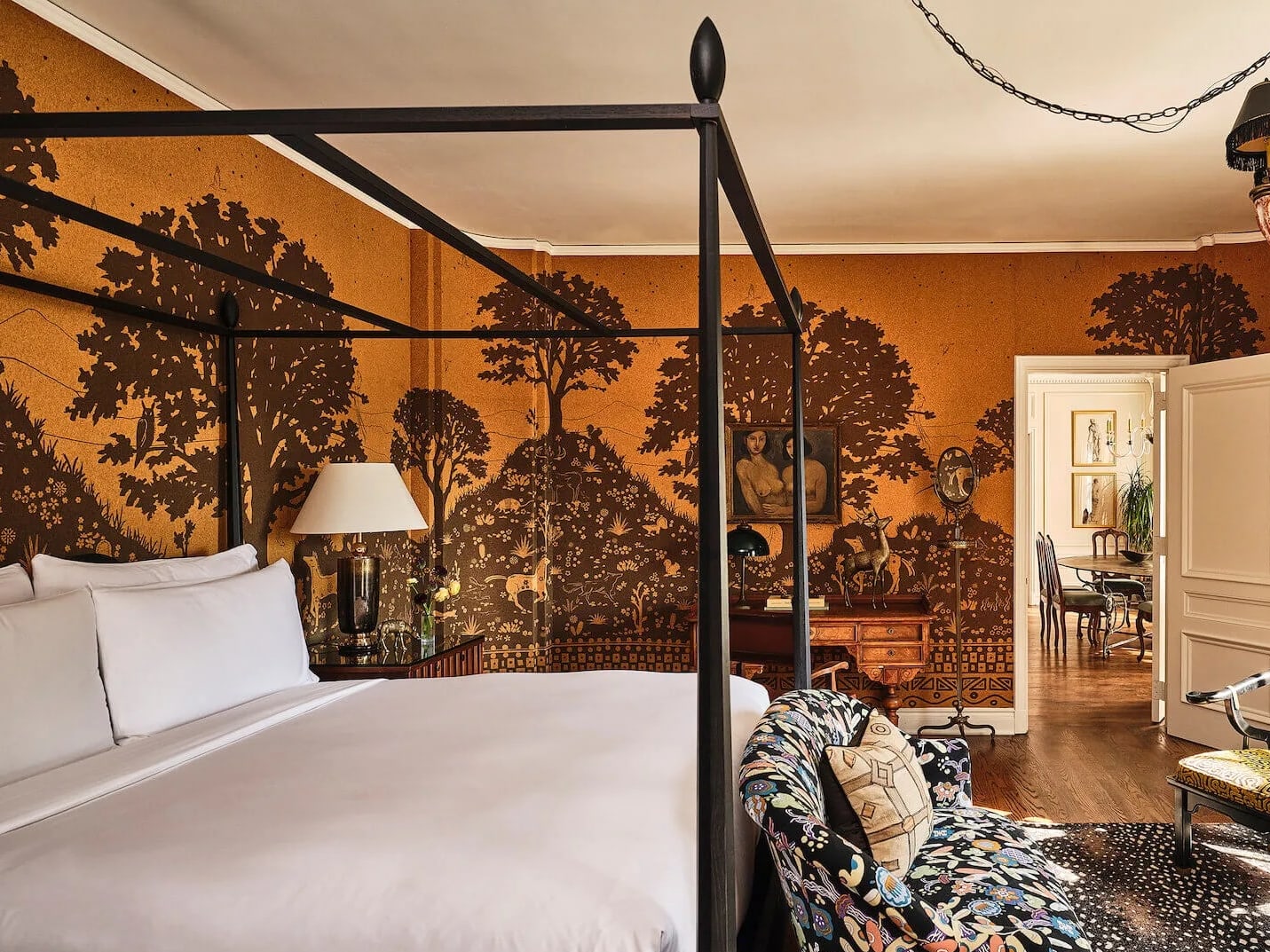 Hotel room in the Commodore Perry Estate with a decorative wallpaper and queen bed