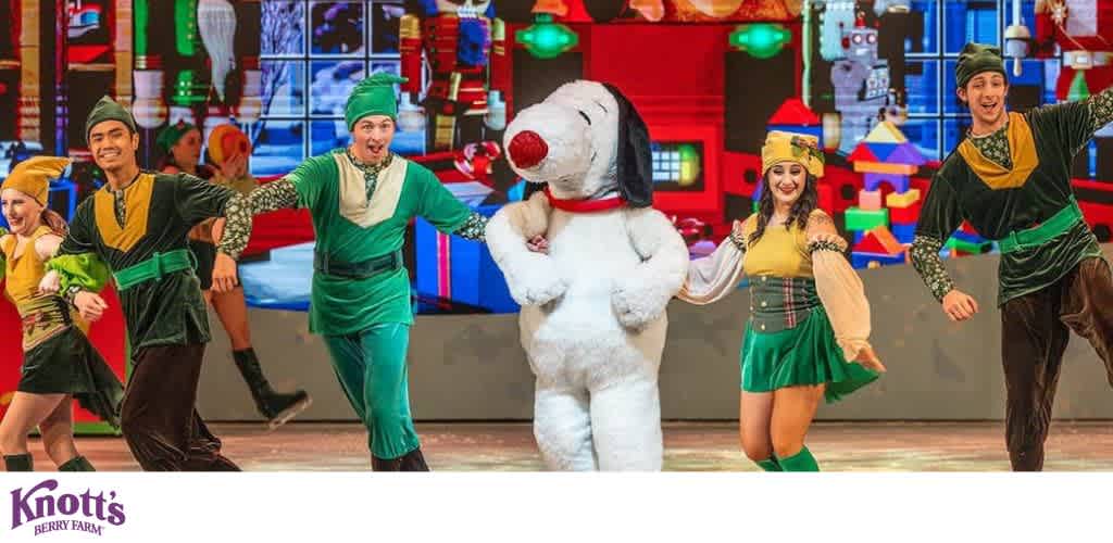 Snoopy on stage with dancers in elf and toy soldier costumes at Knott's Berry Farm.