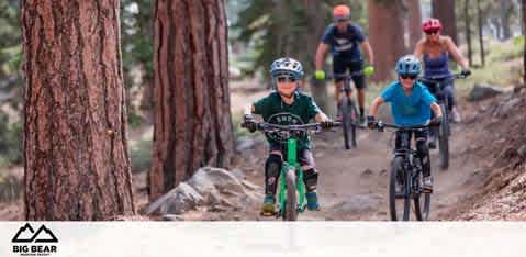 Image Description: Three mountain bikers are captured mid-ride on a dirt trail amidst a forest of tall, slender pine trees. The closest rider, who appears to be a young child, leads the pack with focus and determination, sporting a dark green jersey, black shorts, and a matching helmet. Following are two adult riders, one in a blue jersey and the other slightly out of focus in the background. All riders wear helmets and are riding on mountain bikes well-suited for the rugged terrain. Above them, the words "BIG BEAR" indicate the location, alongside a stylized mountain logo.

Visit FunEx.com for the lowest prices on tickets to your next outdoor adventure, where savings on fun experiences go hand-in-hand with the thrill of the ride.