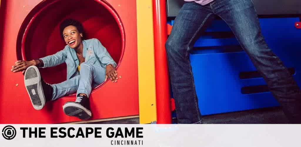 Image split into two panels for The Escape Game Cincinnati. Left panel shows a joyful person sliding down a red tube, wearing casual clothes. Right panel focuses on a person in jeans, poised to step through a blue, open hatchway. Both depict elements of escape room challenges.