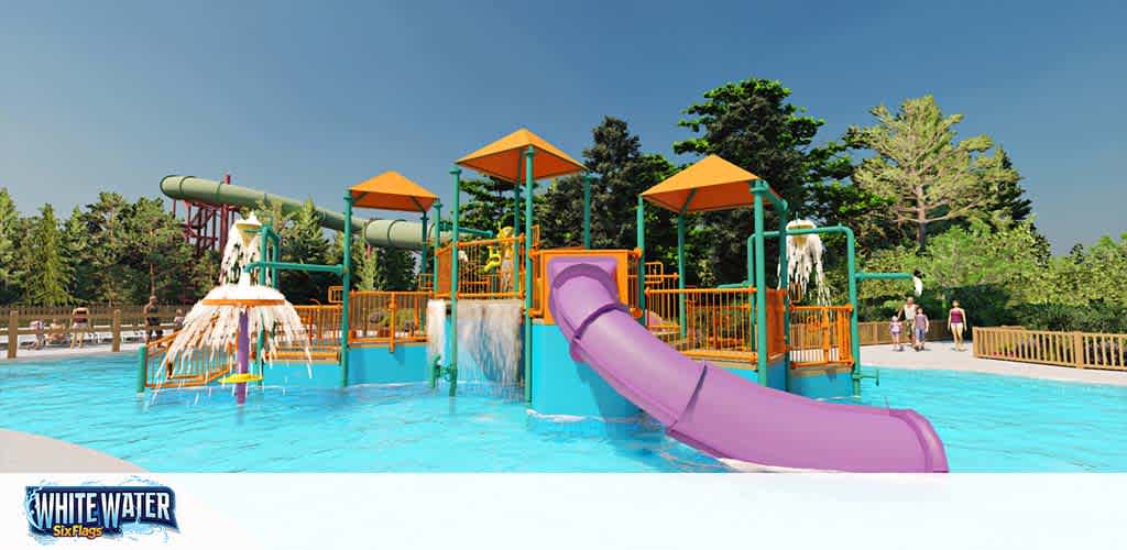 Image displays a vibrant water playground at Six Flags White Water park. Features include a pool with a purple slide and multiple water spraying structures shaded by orange canopies, set against a backdrop of trees under a clear blue sky.