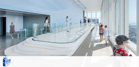 Image depicts an observation deck with panoramic windows offering a clear sky view. Visitors are scattered about, standing and walking. In the foreground, a person is seated wearing a red patterned top, looking outwards. The space is modern and bright with natural light.