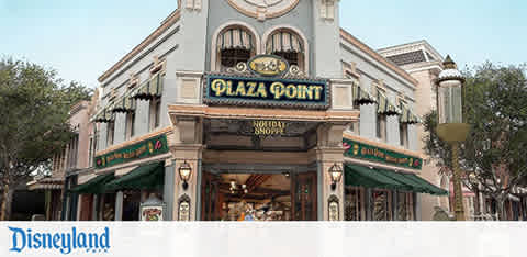 Image of Disneyland's Plaza Point, a holiday shop with festive decorations and signage.