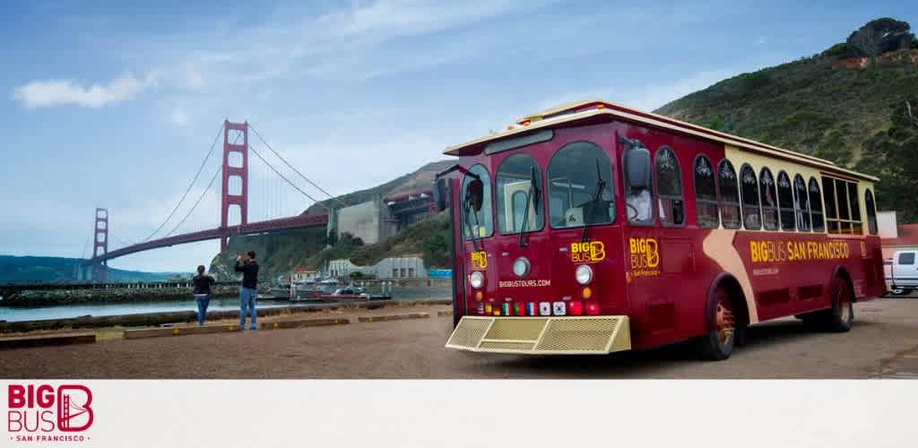 A red tour bus with "Big Bus San Francisco" branding in front of the Golden Gate Bridge.