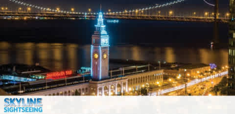 Night view of a lit clock tower by a bridge with "Skyline Sightseeing" text.