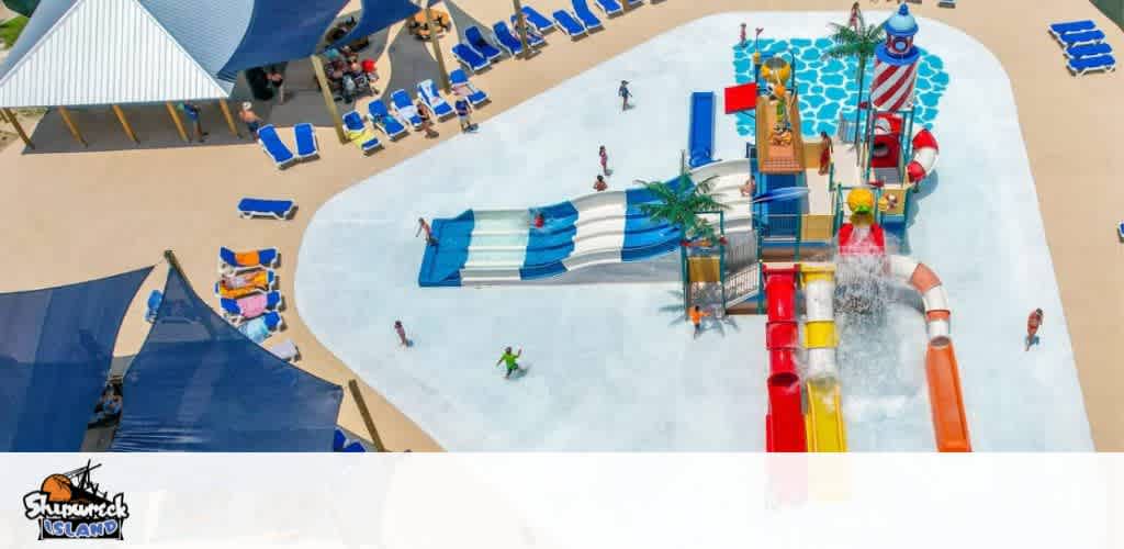 Aerial view of a colorful waterpark with slides, umbrellas, and loungers.