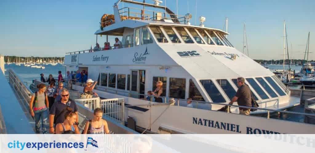 Passengers disembark a white ferry boat named Salem Ferry under a clear blue sky. Several boats are docked in the calm marina in the background. The scene conveys a leisurely atmosphere with people casually walking on the ramp. The image includes the logo 'cityexperiences' accompanied by a stylized wave.