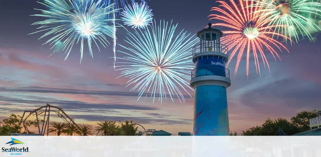Fireworks above a SeaWorld-themed lighthouse at dusk.