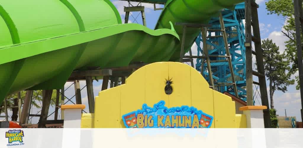 Bright green waterslide at a water park.