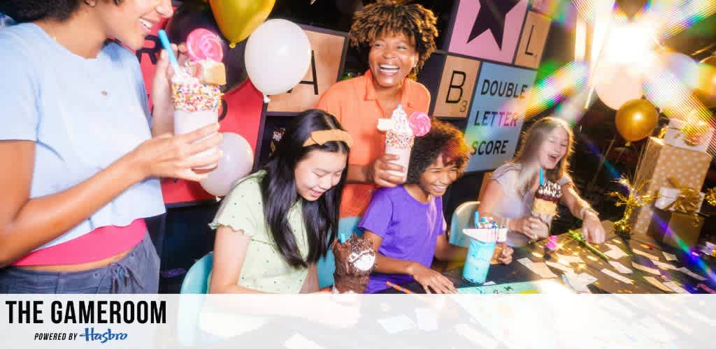 A group of people enjoying milkshakes and playing games at a festive gathering.