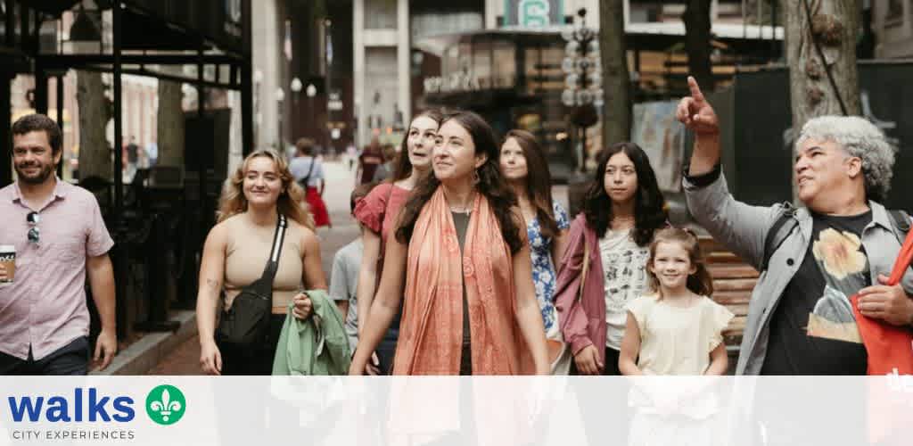 Group of diverse people walking outdoors in an urban area with a guide showing something to the group