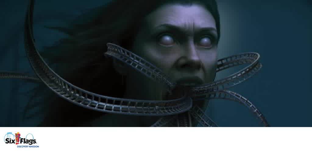 A surreal face with white eyes and roller coaster tracks emerging from its mouth, set against a dark background.