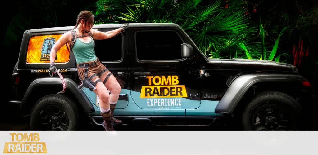 A woman in adventure gear leaning on a black Jeep with tomb raider branding parked in front of lush green foliage.