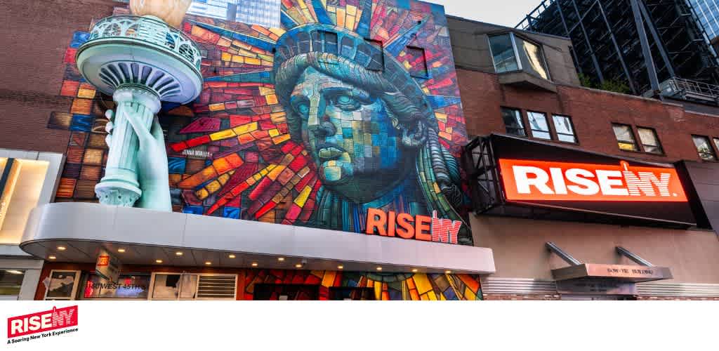 Colorful mural of a woman with a cityscape and the word RISE with bold letters on a building facade.