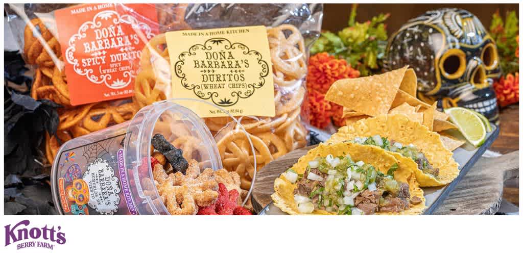 An assortment of packaged snacks, colorful candies, and tacos with festive decorations.