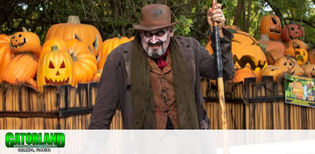 Person in Halloween costume with pumpkins and spooky face paint.