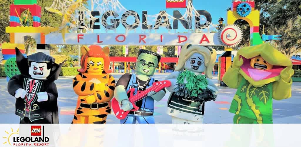 Five LEGO figures in costumes stand in front of the LEGOLAND Florida Resort entrance.