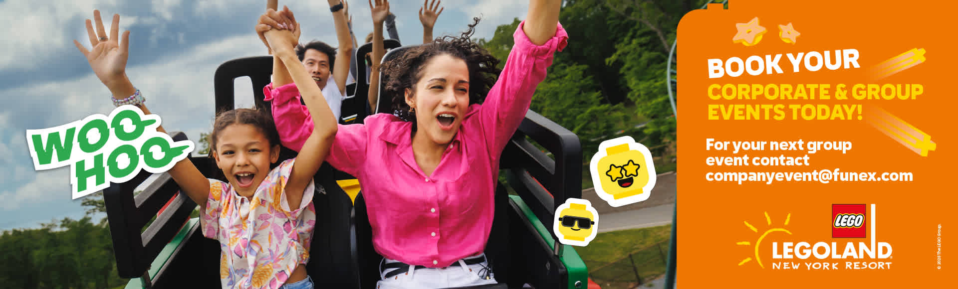 Group of smiling people enjoying a roller coaster ride outdoors with bright sky and greenery in the background