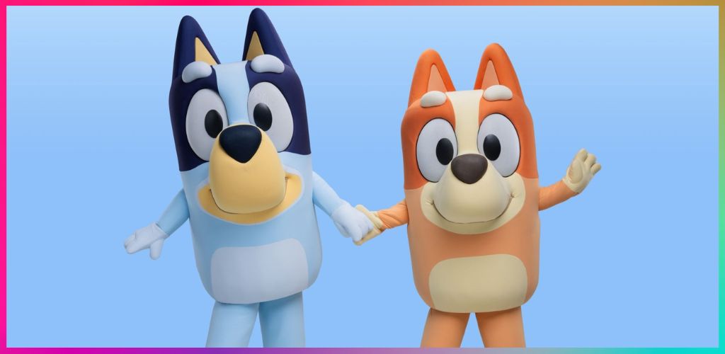 Two cartoon characters resembling dogs holding hands against a light blue background, one blue and white and the other orange and cream, with a colorful border.