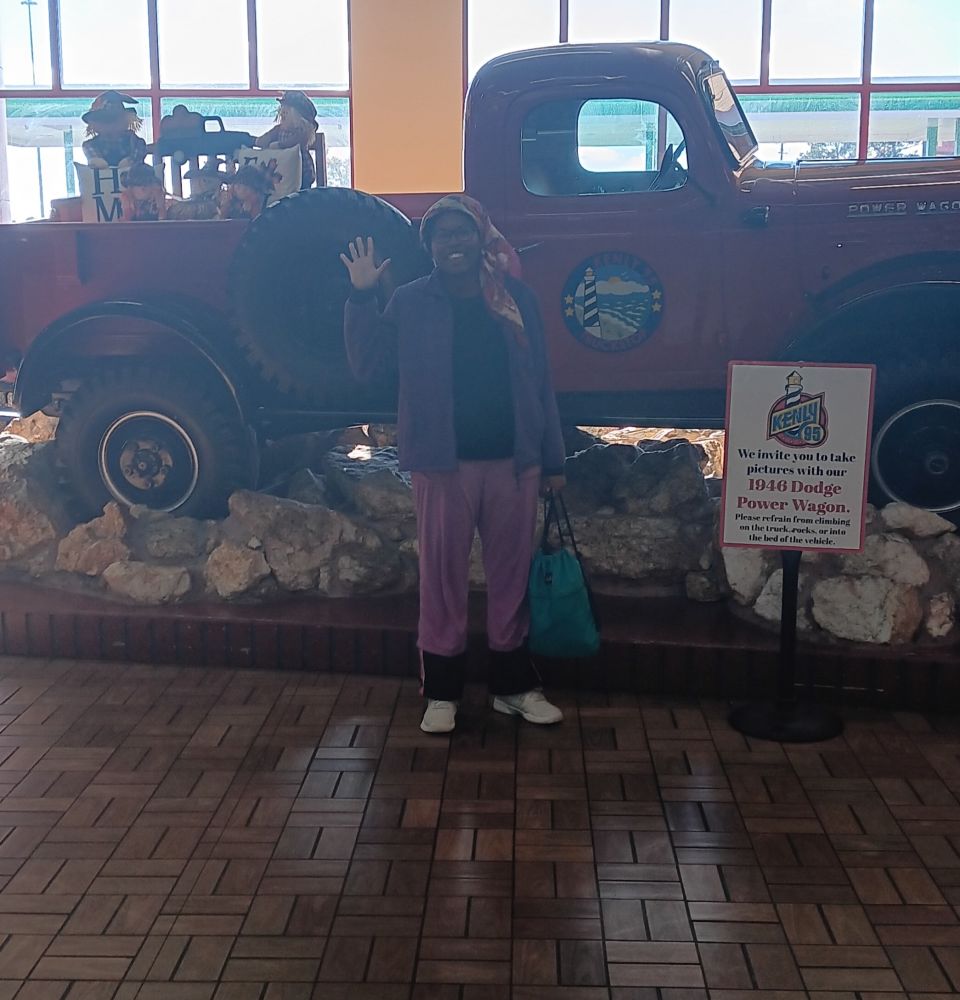 Me standing by a remodeled version of a vintage car