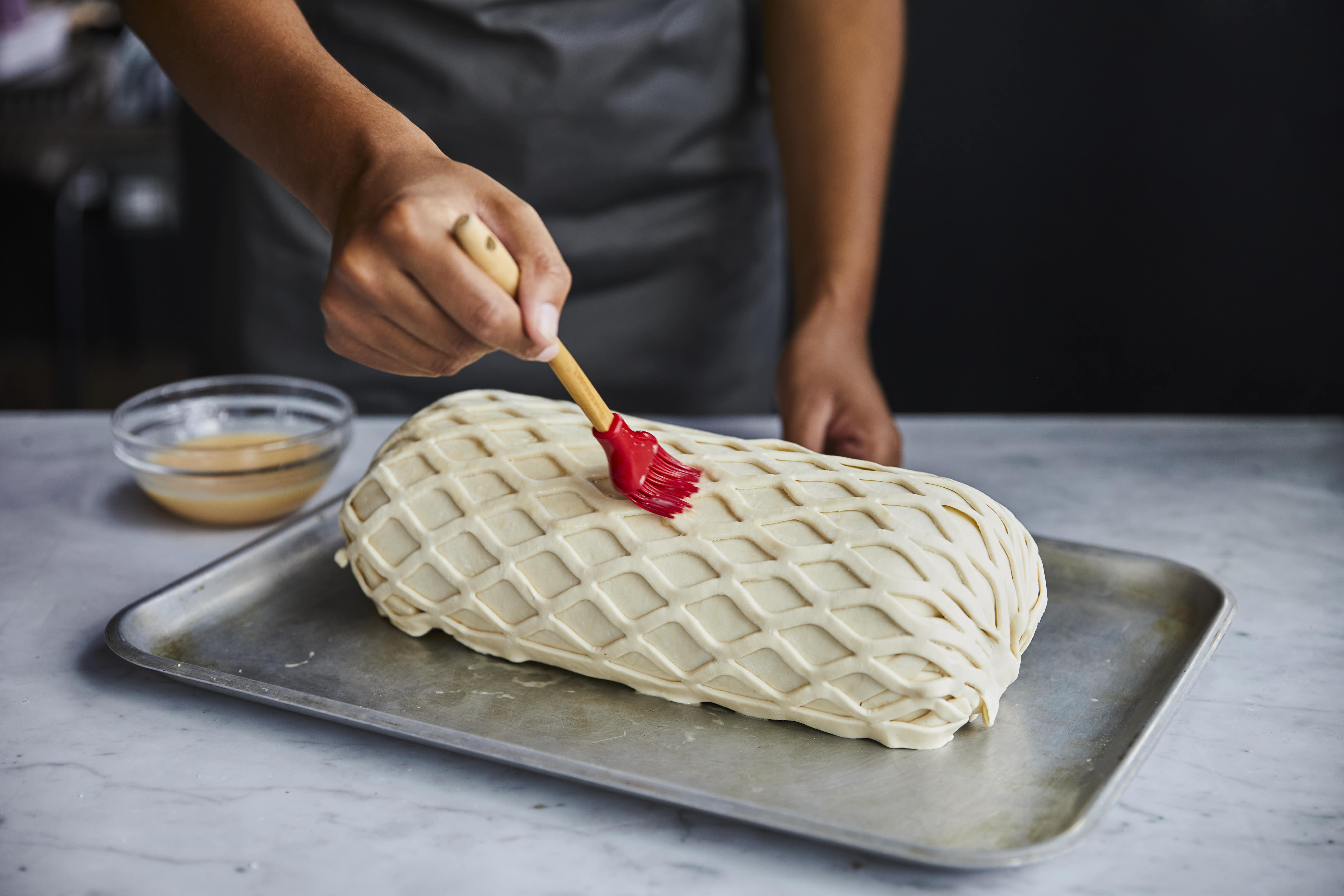 http://res.cloudinary.com/gordonramsay/image/upload/v1628357818/GRA/Classes/Half%20day/Beef%20Wellington%20masterclass/GRA_Beef_Wellington_masterclass_Pastry_lattice_brushing_glazing_egg_wash_290721_2_q55usk.jpg