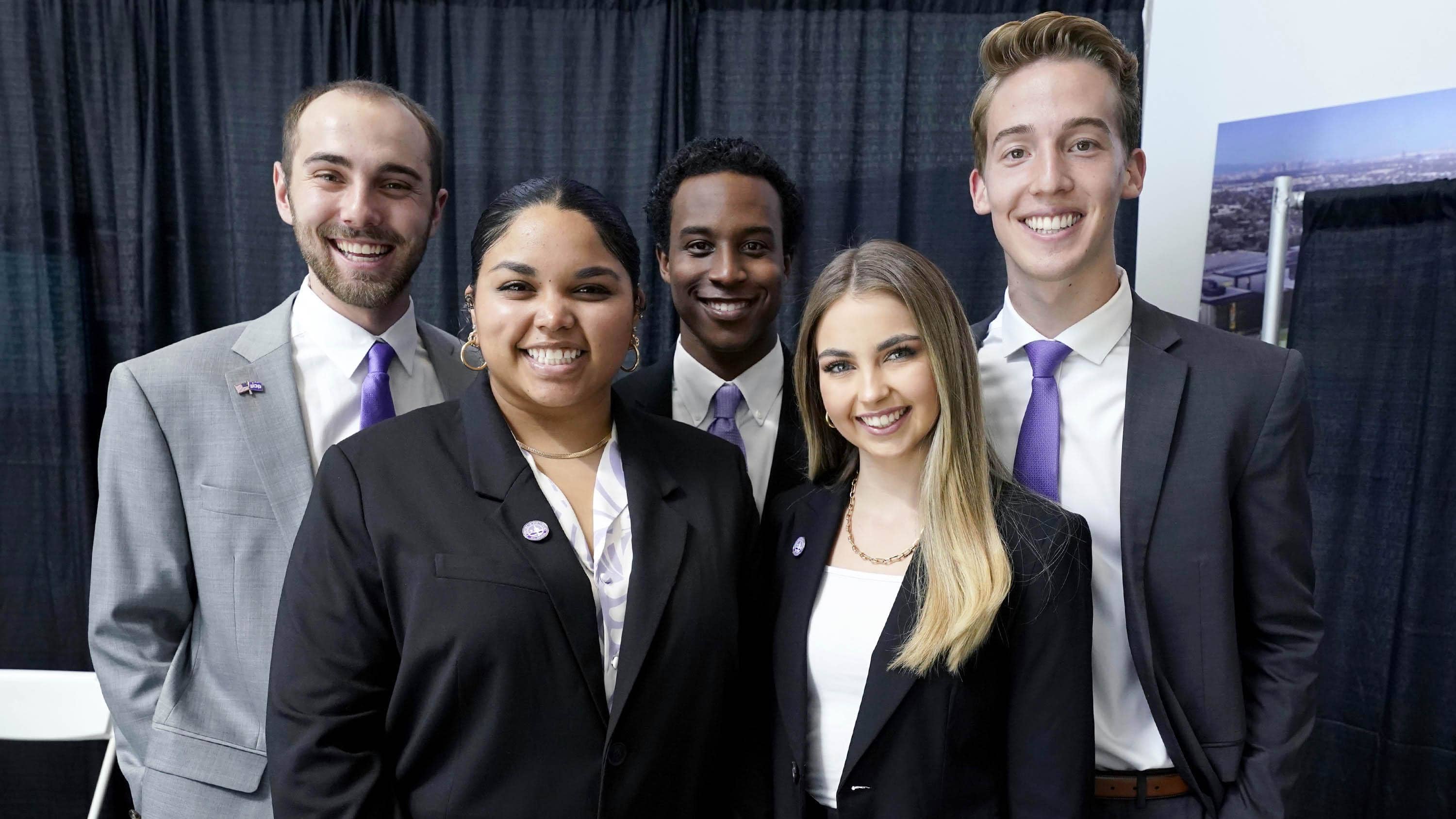 Male and female business degree students dressed professionally at GCU