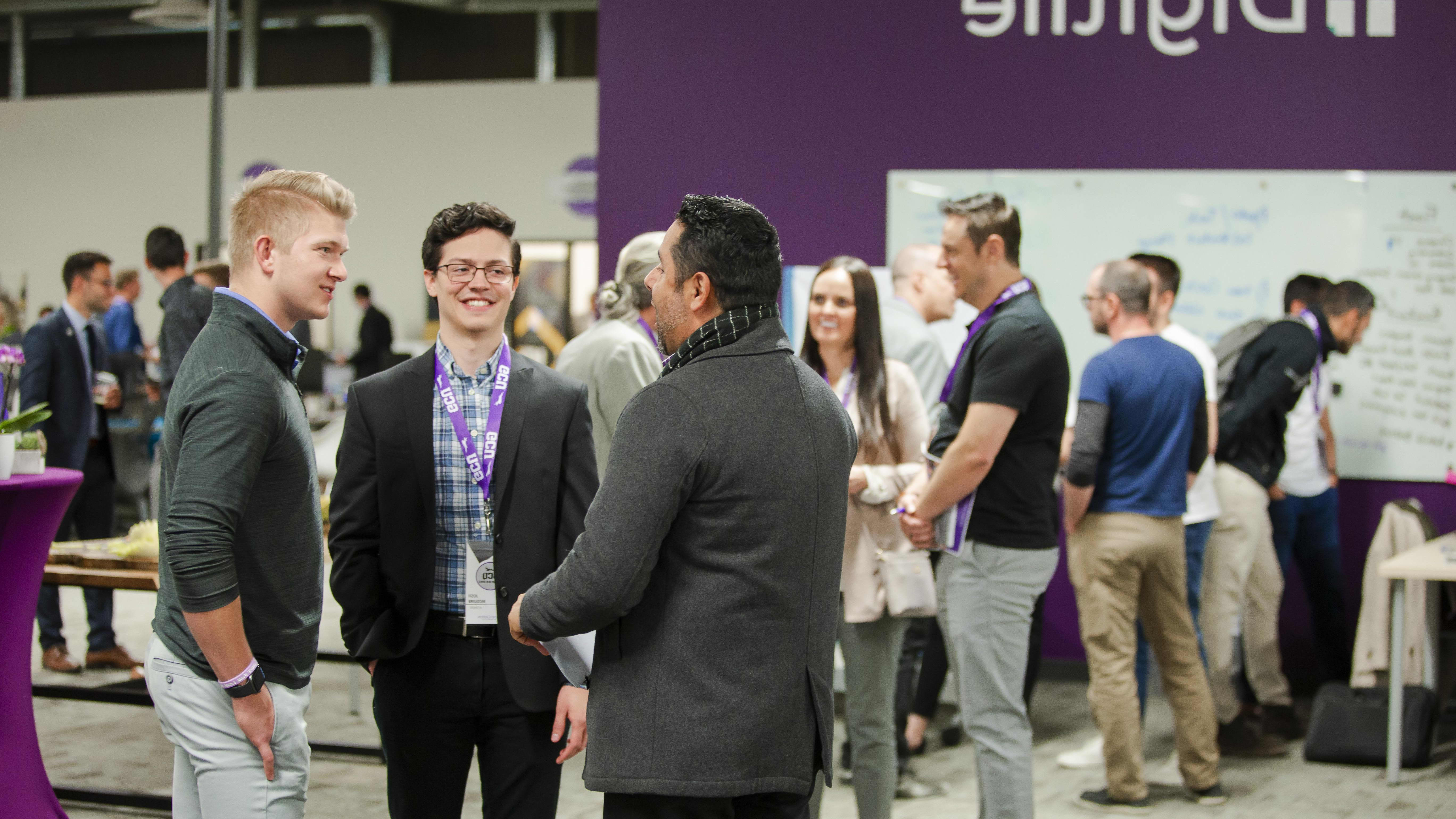 students talking to a professor at a canyon ventures event