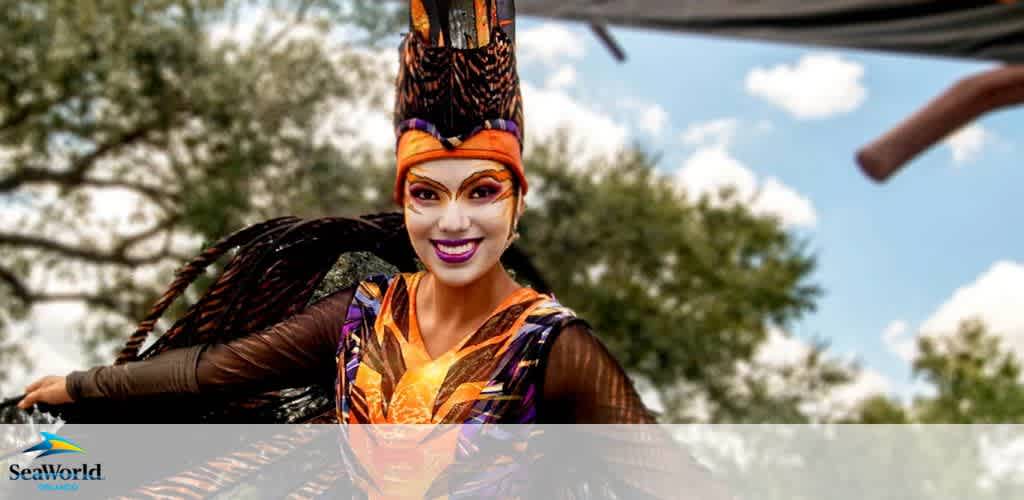 Performer in a colorful bird-themed costume outdoors.