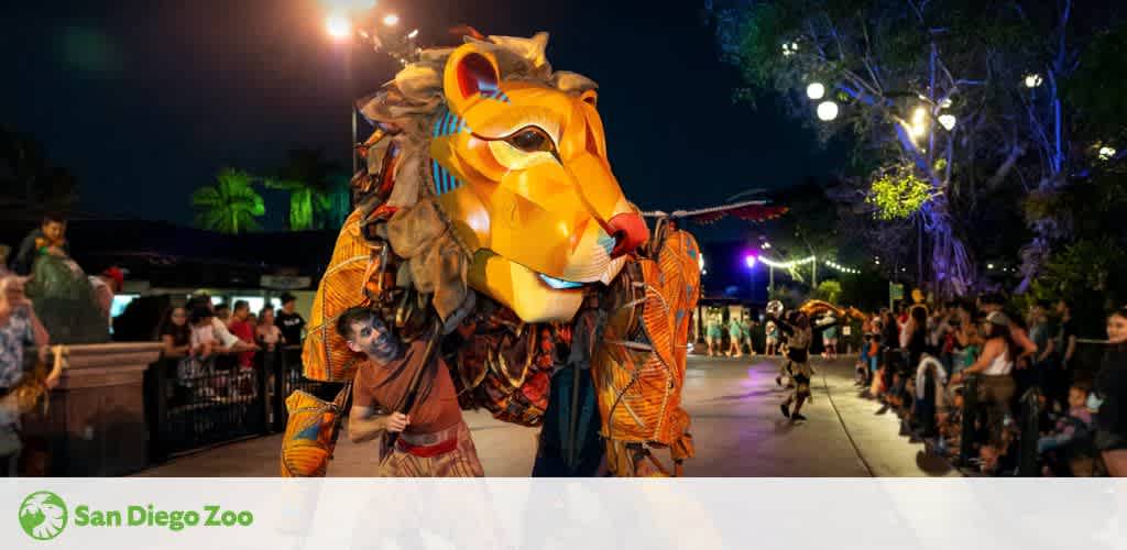 A colorful lion puppet in a parade scene with spectators at night.