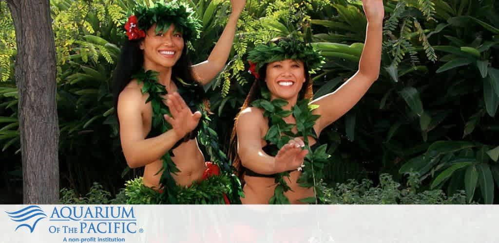Two people in traditional Hawaiian attire dancing with green foliage in the background. Aquarium of the Pacific logo is at the bottom.