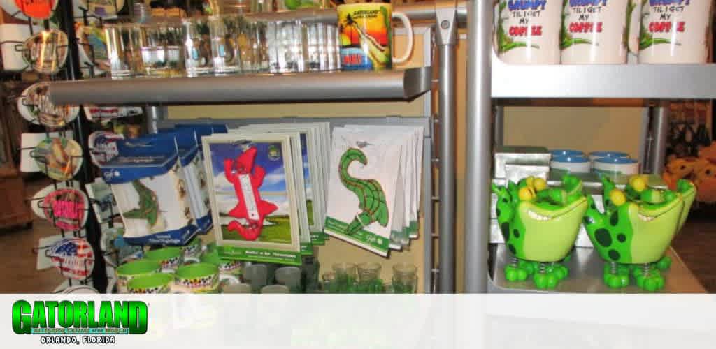 Shelves displaying souvenirs like postcards, mugs, and alligator-themed ceramics.