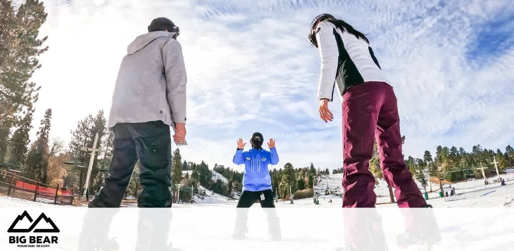 This image showcases a winter sports scene at Big Bear Mountain Resort with a clear sky above. Three individuals appear in the foreground, with two of them facing each other on either side of the frame, seemingly ready to engage in a playful snowboard or skiing activity. The central figure, with his back facing us, is shown preparing to make a move, possibly starting a race or game. All are appropriately dressed in winter sports gear, including helmets, suggesting an emphasis on safety as well as fun. The snow-covered slopes are dotted with other winter sport enthusiasts in the background, with a line of evergreen trees and ski lifts visible, completing the idyllic winter resort atmosphere.

At GreatWorkPerks.com, we offer exclusive savings on tickets to the best winter experiences—ensure you don't miss out on the lowest prices available for your next snow-filled adventure!