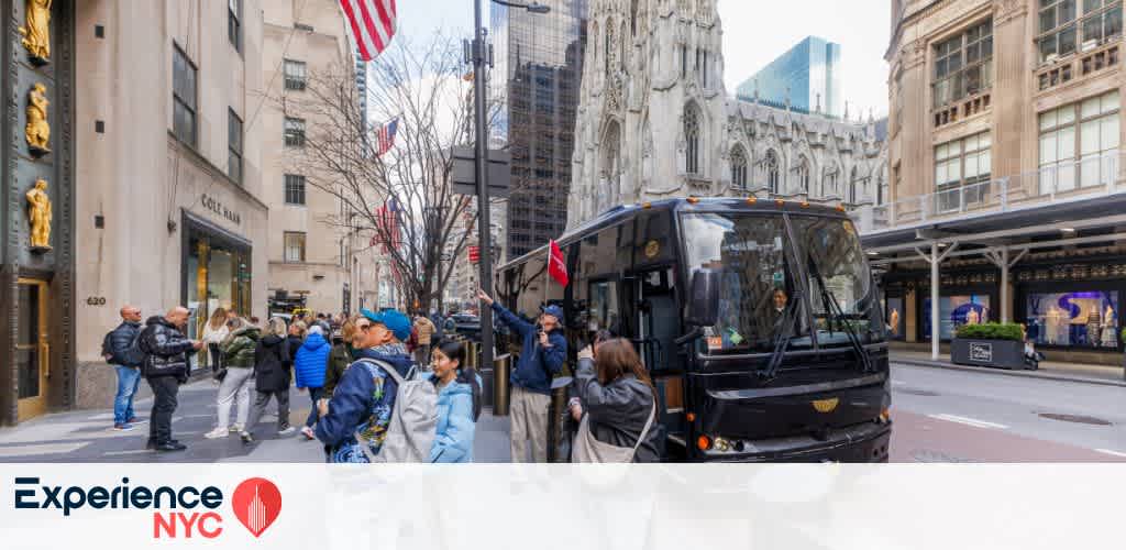 A bustling New York City street features a tour bus, and a diverse group of people gathered on the sidewalk. Elegant buildings with intricate architecture surround the scene. An American flag is visible above, and trees are bare, indicating a cooler season. The atmosphere is lively, capturing the essence of NYC exploration.