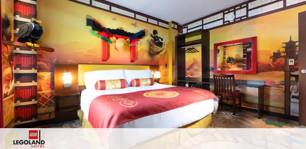 A pirate-themed room at LEGOLAND Hotel with a family enjoying playtime. A child wearing a pirate hat stands on the bed with a sword. Another child holds a shield. Two adults in the background cheer and play along with joyful expressions. The room features bright red and white striped walls and wooden decor.