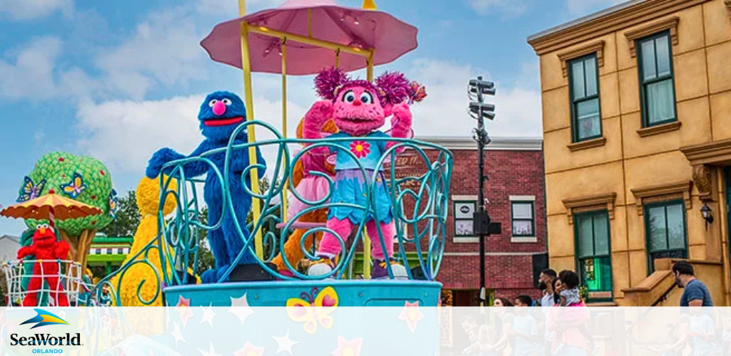 Sesame Street characters on a colorful parade float at SeaWorld Orlando.