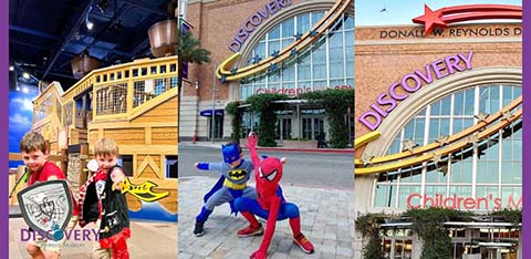 Three images of the exterior and interior of the Discovery Children's Museum. The left photo shows two children dressed as superheroes. The middle shows a person in a Spiderman costume posing. The right photo displays the museum's entrance with prominent signage.