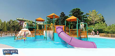 A vibrant water playground with a large purple slide on the right and multiple smaller slides in the center. Shaded areas with orange roofs offer respite from the sun. Trees line the background under a clear blue sky, and the White Water logo is visible in the bottom left corner.