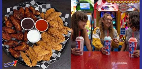 This image is a split-screen photograph representing two different scenes at an entertainment venue. On the left, there is a close-up of a platter of food placed on a table with a colorful surface reminiscent of classic arcade styling. The platter includes a generous serving of fried chicken wings and chicken tenders, accompanied by three different dipping sauces contained in small circular bowls: one appears to be creamy white, another is bright red, and the third is a darker, possibly barbecue sauce. The right side of the photo features three individuals who appear to be enjoying a social moment at an arcade. They are standing and facing each other with vibrant smiles, each holding a cup with the label "ICEE" on it, suggesting they are enjoying a frozen beverage. Behind them, a colorful arcade game with the words "Carnival King" is visible, adding to the lively atmosphere. For those planning their next visit, GreatWorkPerks.com offers unbeatable savings on tickets, ensuring an affordable experience without compromising on fun.