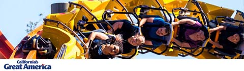 This image features a dynamic scene from California's Great America theme park. Visitors are strapped into a vibrant, yellow roller coaster with black harnesses, their bodies suspended upside down as they appear to be mid-loop on the ride. The sky is a clear blue, indicating pleasant weather. There's a palpable sense of excitement and thrill among the riders, who have various expressions of joy and exhilaration. Below the image, the park's name is displayed with its logo. Get ready for an adrenaline-packed adventure and don't forget to check GreatWorkPerks.com for amazing discounts, savings, and the lowest prices on tickets for your next trip to California's Great America.