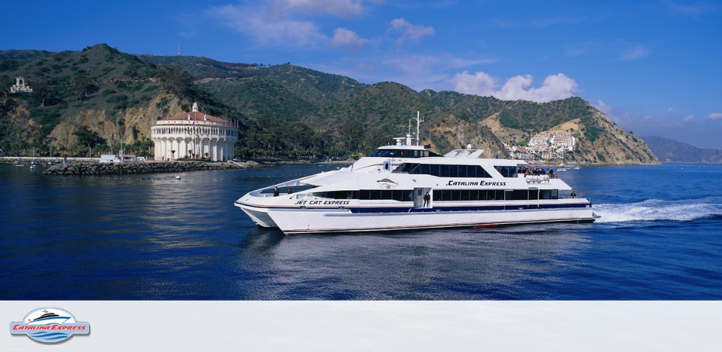 Image Description:
The photograph features a large, sleek white and blue high-speed ferry vessel traversing a vast expanse of open blue water. The ship, identified as "Catalina Express," creates a frothy wake as it cuts through the sea. On its upper deck, a group of passengers can be seen enjoying the sunshine and ocean views behind protective railings. The sky is clear, indicating favorable weather conditions for a sea voyage. The vessel appears to be in motion, likely transporting its guests to a scenic destination.

Enhance your ocean adventure and embrace the spirit of the sea by securing your voyage with GreatWorkPerks.com, where you can find the lowest prices on tickets, ensuring that your trip is not just memorable but also comes with the added bonus of savings.