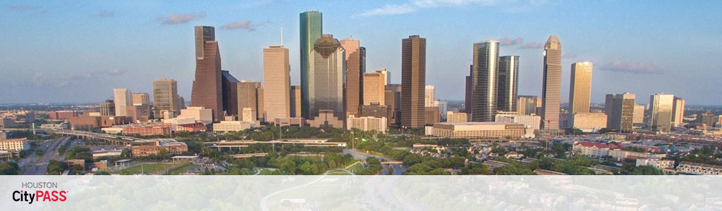 A panoramic view of Houston's skyline under a clear sky. At the bottom, the text reads 'Houston CityPASS'. Tall buildings dominate the center, with greener, less dense areas to the sides.