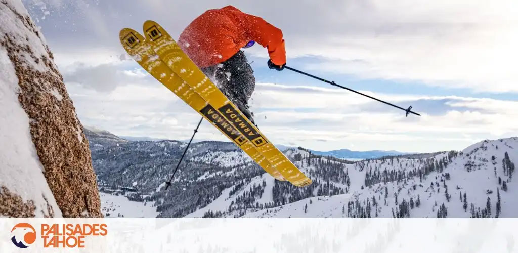 Image Description: The photo captures a dynamic winter sports scene in an expansive snow-covered mountainous landscape. A skier clothed in vibrant orange and dark attire is snapped mid-jump against a cloudy sky, exhibiting an athletic pose with skis crossed and poles extended. The bold yellow skis and the skier's intense focus contribute to the action-filled atmosphere of the image. The terrain below is a mix of rocky outcrops and densely forested slopes, stretching into the distance with a series of peaks and valleys. The logo in the bottom left corner reads "PALISADES TAHOE," suggesting a specific ski resort location.

Discover unbeatable savings and the lowest prices on tickets for your next mountain adventure at GreatWorkPerks.com.