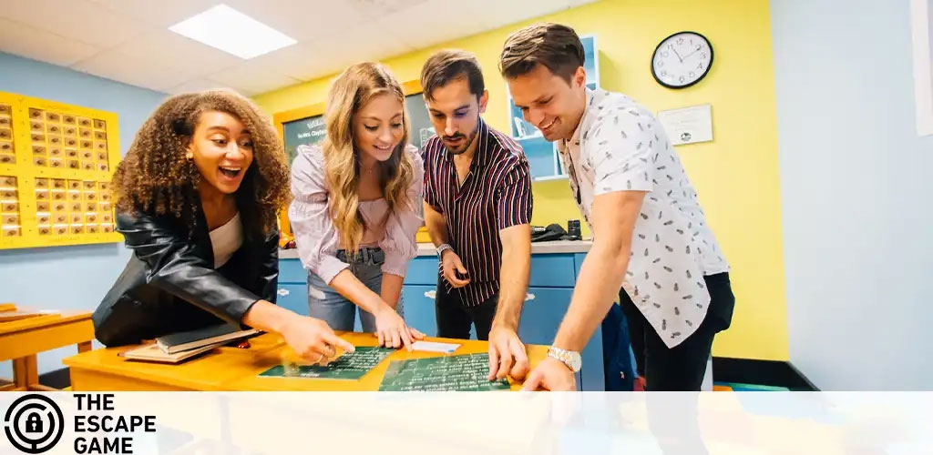 Image Description: The photograph captures four individuals engaged in an escape room activity. From left to right, there is a young woman with curly hair smiling broadly as she leans over a table, pointing at something off-camera. Next to her is another young woman with long straight hair, also looking engaged and smiling as she examines what appears to be a clue or a puzzle piece. A young man wearing a patterned shirt stands beside her, intently focused on the task at hand with his hands on the table. Finally, on the far right, another young man is seen standing and smiling while working on the puzzle. They are all gathered around a table filled with various items that might be part of the escape room challenge, such as papers and a briefcase. The room has a yellow wall with a clock, giving it a vibrant, inviting look. In the corner of the image, the logo "The Escape Game" is visible.

Visit GreatWorkPerks.com for your next adventure! Don't miss out on exciting experiences at the lowest prices — incredible discounts and savings on tickets are just a click away!