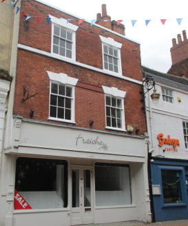 The subject property comprises an attractive three storey building of traditional brick construction beneath a pitched tile roof. 

Internally, the property provides two floors of retail accommodation along with a staff room and storage area to the s...