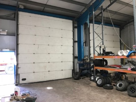 The property provides a modern industrial premises benefiting from a large surface and fenced yard to the front. The unit is accessed via two roller shutter doors and has an internal eaves height of approx. 5.2m (4.3m to the underside of the stanchio...