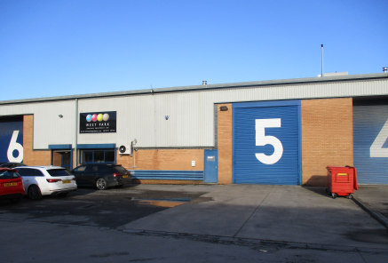 The property is a modern mid terrace industrial unit constructed around a steel portal frame with brick and metal profile cladding under a pitched profile sheet roof. The property benefits from: