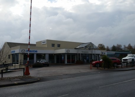 The property is situated in a high profile location on the A3015 which links J29 of the M5 to Exeter city centre. The property comprises showroom and offices at ground floor, offices/storage above and workshops at lower level with parts storage at an...