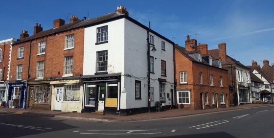 A 1,321 sq ft (122.69 sq m) property comprising an end of terrace, corner property

which is arranged over three floors with a retail frontage to the High Street on the ground and office units above.