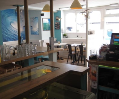 Trendy Licensed Cafe Located In St Agnes\nExternal Seating\nRef 2400\n\nLocation\nThis delightful Cafe is located in the Cornish sea side village of St Agnes. The Village has a population of circa 7,565 and sits in both a designated Area of Outstandi...